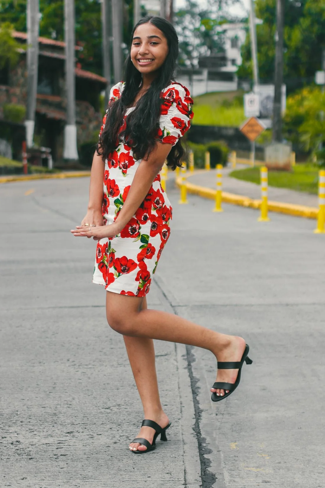 Woman wearing a floral dress on a city street